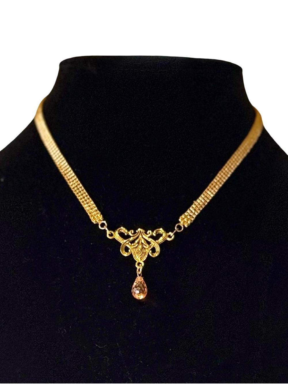 Gold color loom-woven necklace with teardrop crystal and extender